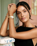 Gold square watch for women with white dial and gold band. The model is Aima by Avelore.