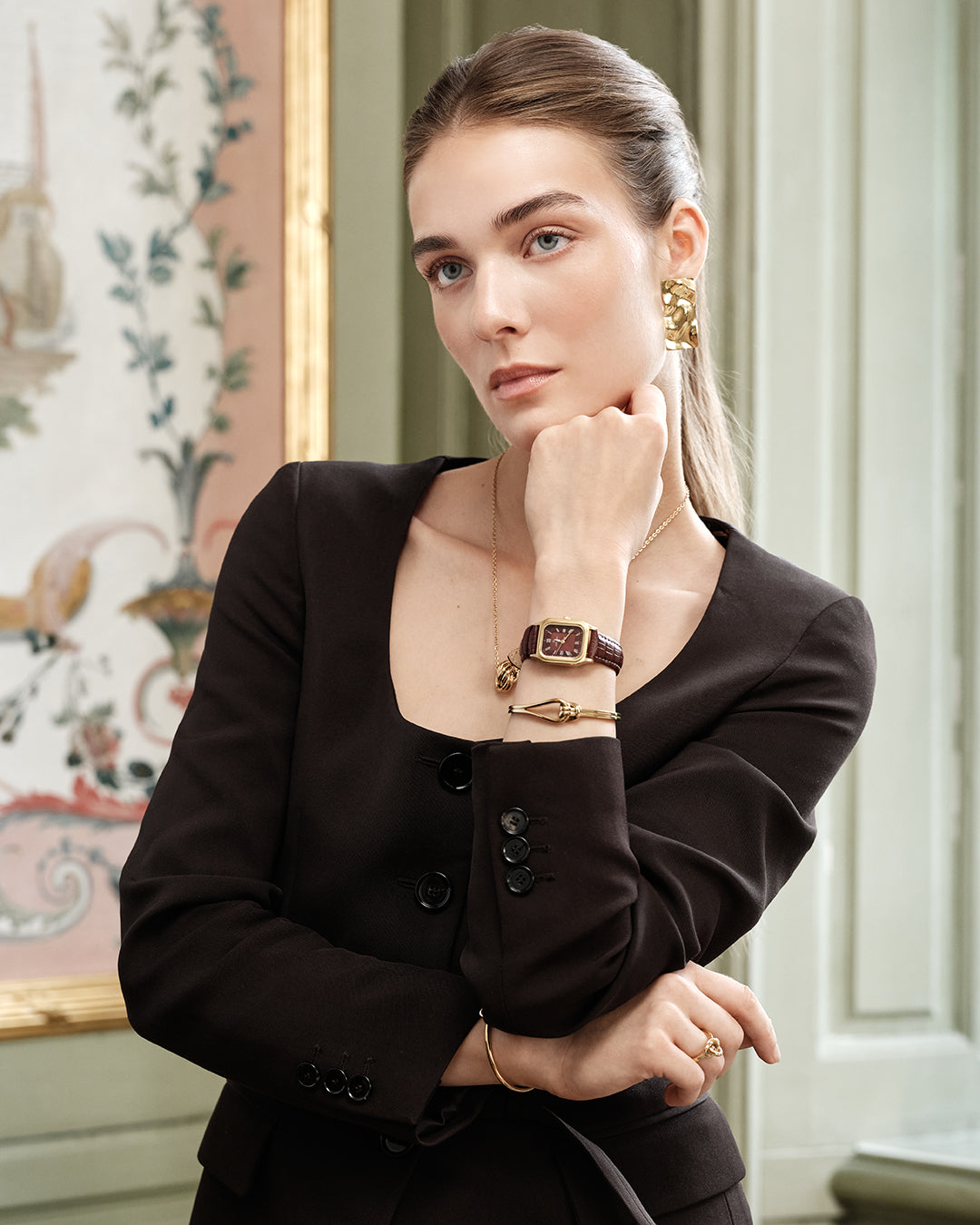 Gold square watch for women with burgundy dial and burgundy leather band. The model is Aima by Avelore.