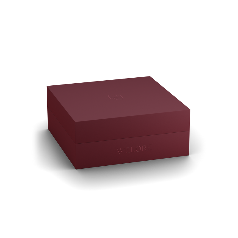 Burgundy jewelry box with 'AVELORE' branding on a white background