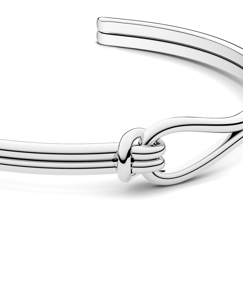 Silver bracelet with loop knot detail. The model is Coce bangle by Avelore Women's Bracelets