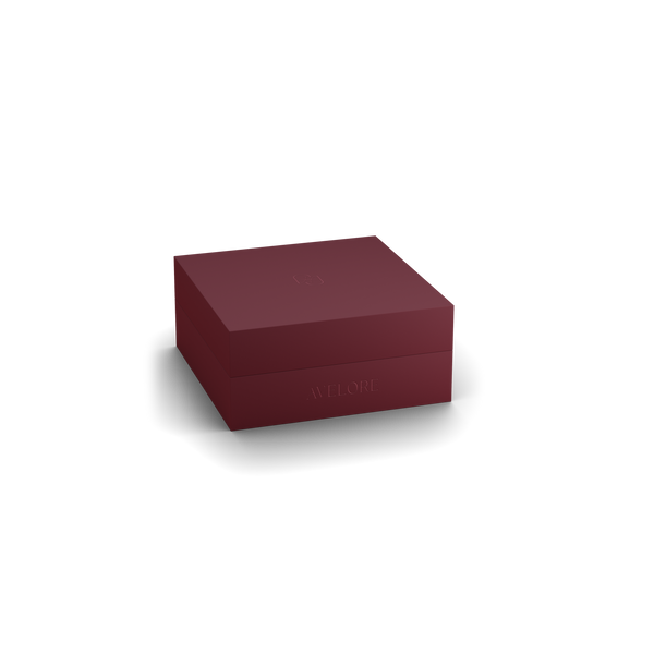 Burgundy jewelry box with 'AVELORE' branding on a white background
