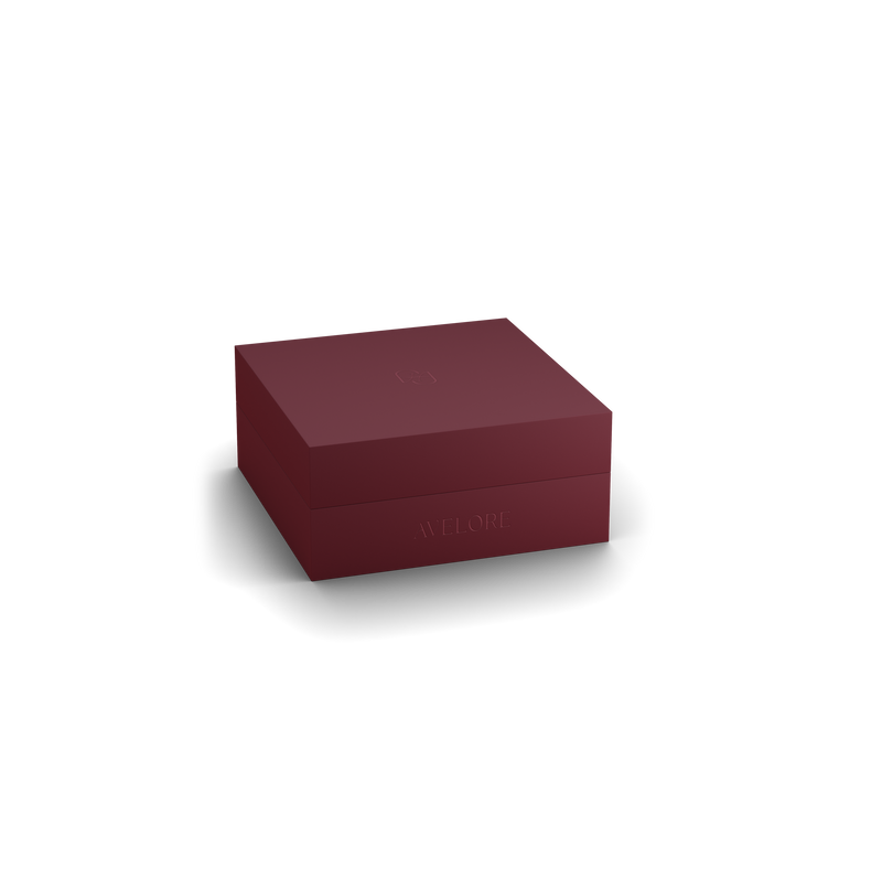 Burgundy jewelry box with 'AVELORE' branding on a white background