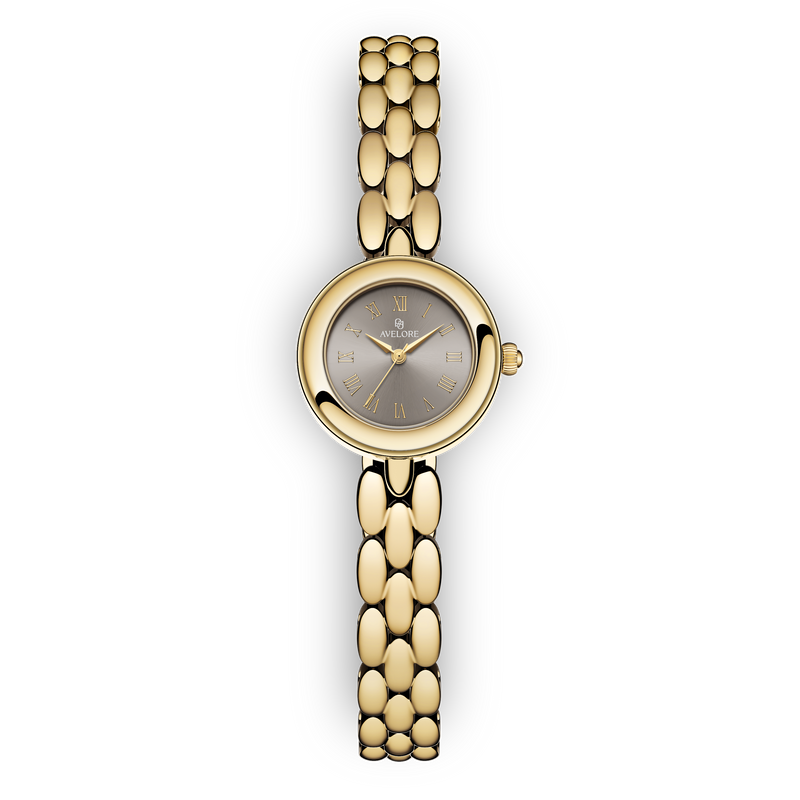 Gold round small watch for women with brown dial and gold band. The model is Eira by Avelore.