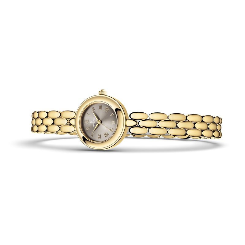 Gold round small watch for women with brown dial and gold band. The model is Eira by Avelore.