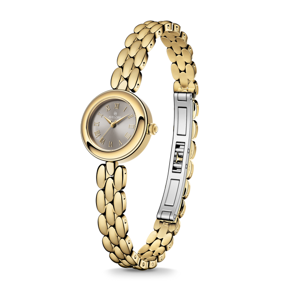 Gold round small watch for women with brown dial and gold band. The model is Eira by Avelore.