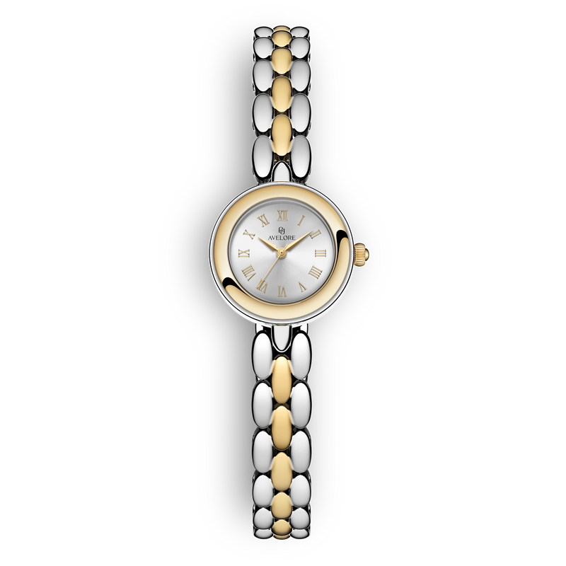 Two-tone round small watch for women with silver dial and silver and gold band. The model is Eira by Avelore.