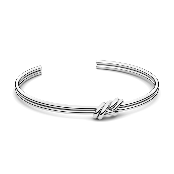 Silver bracelet with triple knot detail. The model is Naia bangle by Avelore Women's Bracelets