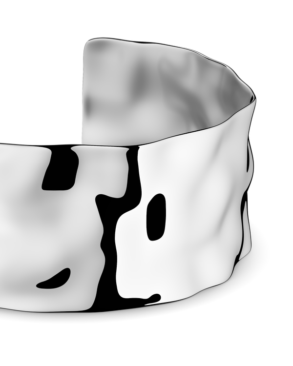 Wide silver cuff bracelet with hammered patterned surface. The model is Noem Bangle by Avelore  Women's Bracelets