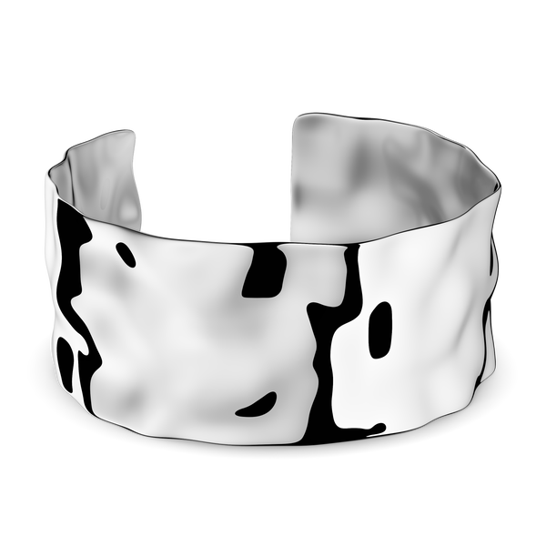 Wide silver cuff bracelet with hammered patterned surface. The model is Noem Bangle by Avelore  Women's Bracelets