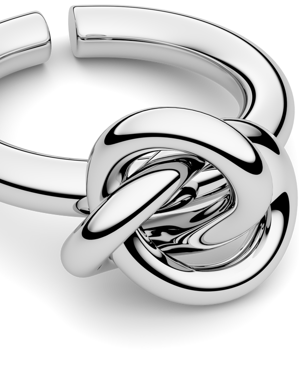 Silver knot ring by Avelore. The model is Veda Ring. Women's Rings.