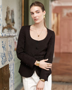 Wide gold cuff bracelet with hammered patterned surface. The model is Noem Bangle by Avelore  Women's Bracelets