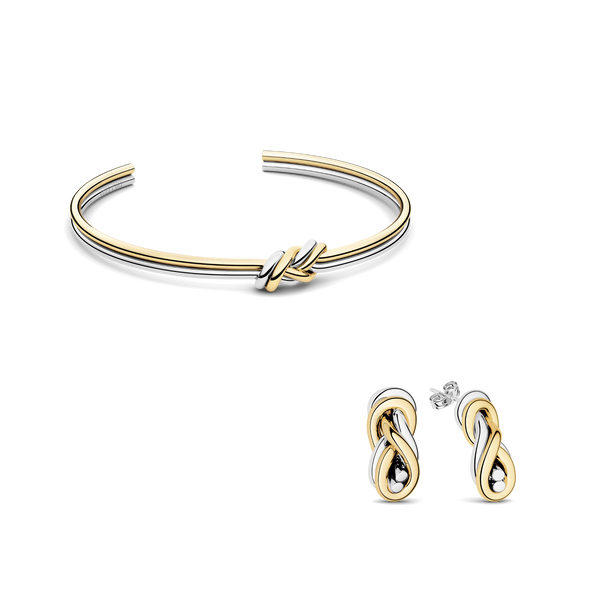 Jewelry set of two-toned knot earrings and two-toned knot bangle. The model is Naia Earrings by Avelore. Women's jewelry set.