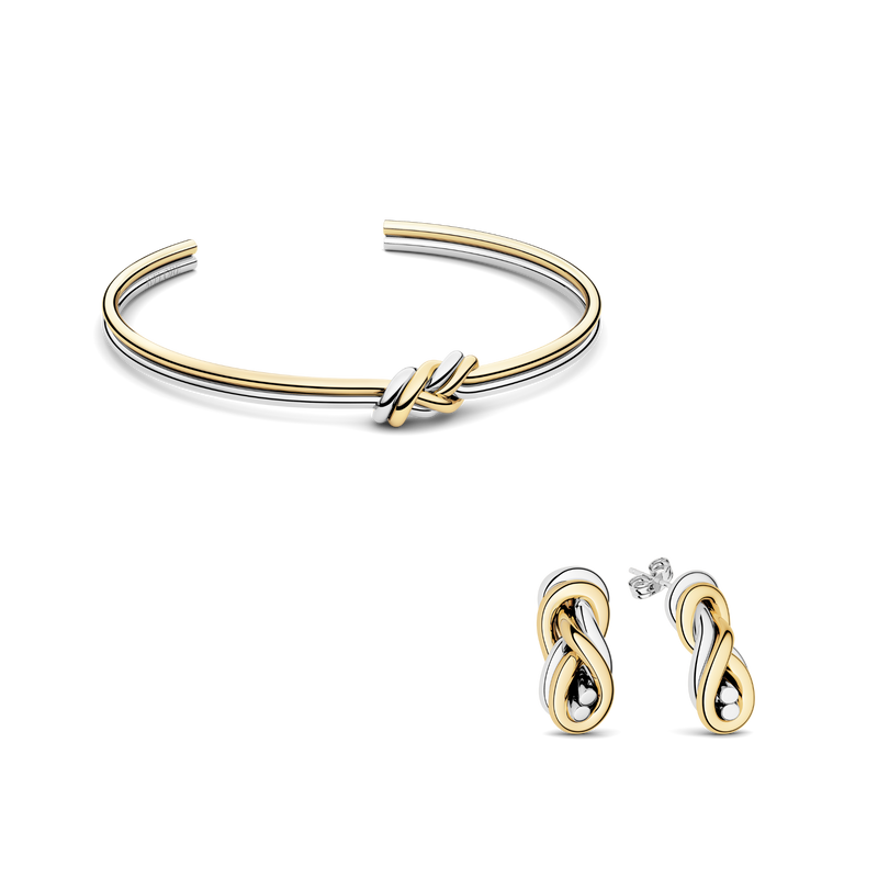 Jewelry set of two-toned knot earrings and two-toned knot bangle. The model is Naia Earrings by Avelore. Women's jewelry set.