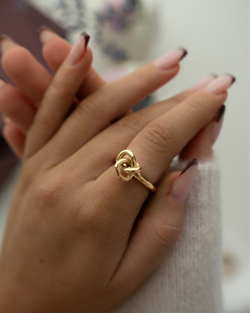 Gold knot ring by Avelore. The model is Veda Ring. Women's Rings.