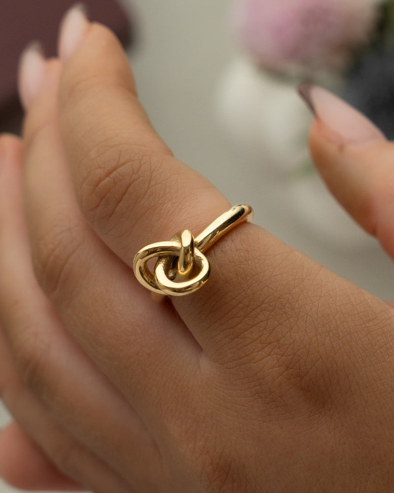 Gold knot ring by Avelore. The model is Veda Ring. Women's Rings.